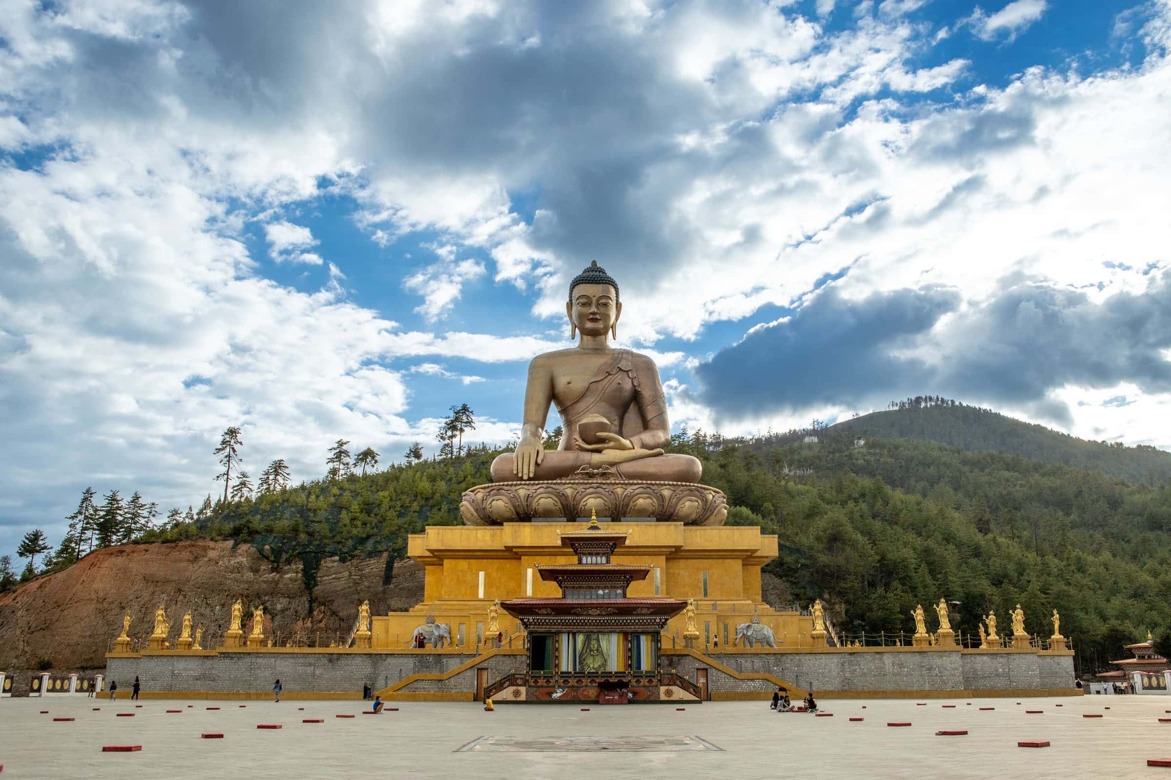 Interior meditation hall with golden Buddha statues